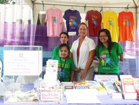 Rosanne Dianente, center, Wadjai Noochan (Chief Librarian), right, and other staff members oversaw the North Star Library second-hand book sale on March 5.